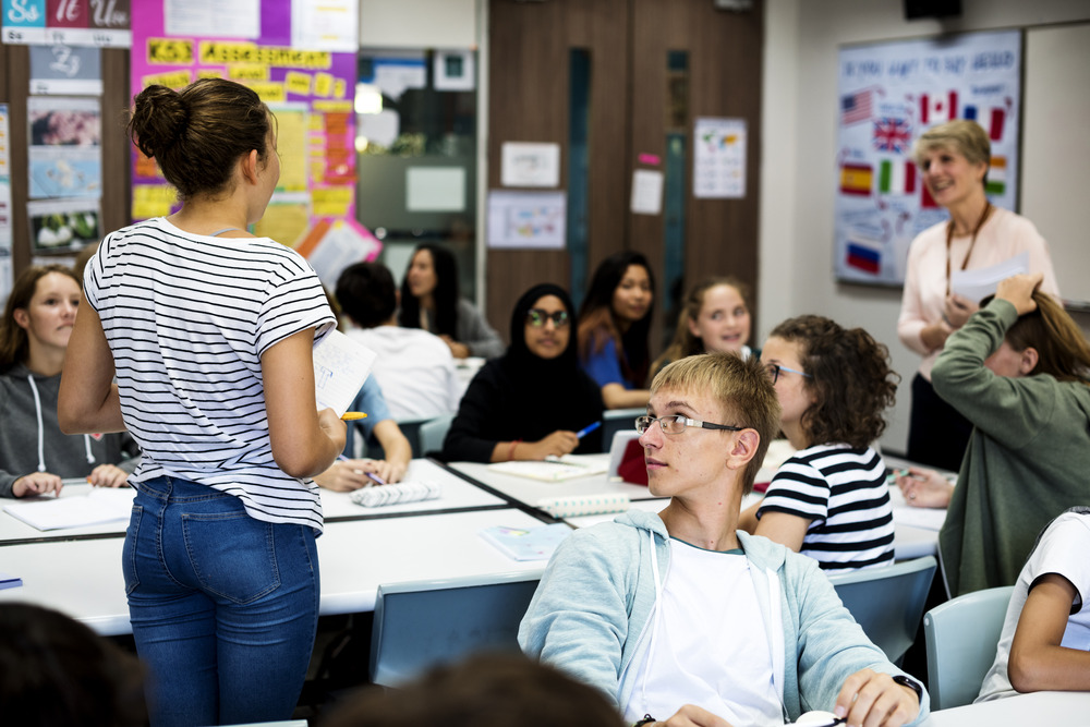 Group of students learning in classroom